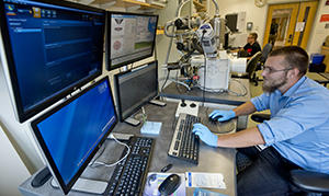 student workin on computer in physics lab