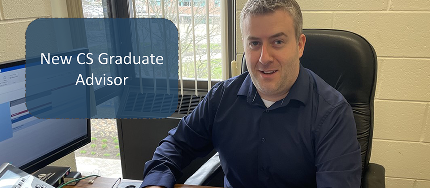 A picture of new CS Graduate Advisor Michael Schillo smiling at the camera while he works. On his right side is a graphic that reads, "New CS Graduate Advisor."