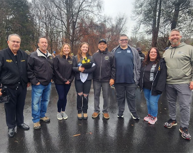 Jocelyn Davis (fourth from left) is joined by her family and members of Deptford council, who surprised the army sergeant with a small homecoming celebration at Almonesson Creek Park on Dec. 28.