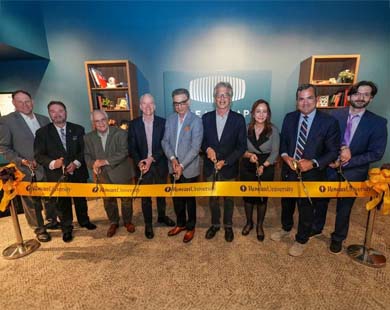 Rowan University President Ali A. Houshmand with Dreamscape Learn co-founder and co-chairman Walter Parkes (center) cut the ribbon Tuesday, May 6, to officially open the Dreamscape Learn Center at Campbell Library.
