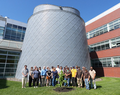 Faculty, staff and students gather around Rowan's Artemis Moon Tree during the tree's planting ceremony this summer.