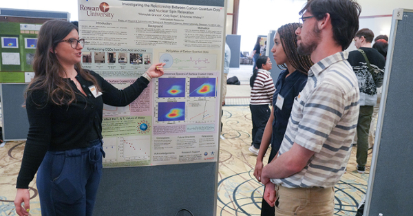 Makaylab Grandal (left) presents her poster during the College of Science & Mathematics' Student Research Day